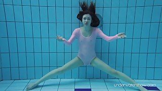 Sexy red haired swimming babe Roxalana Cheh is stripping under the water