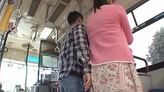 Busty Hana Haruna blows a guy in a public bus