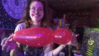 Hairy Hippie Looner Girl With Dreadlocks Inflates Red Balloon