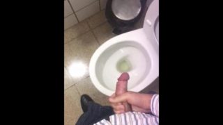 Jerking off in a public toilet. Almost caught by the cleaner!