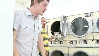 Gleaming gay dude with a tattoo giving a blowjob in the washing room before getting throbbed