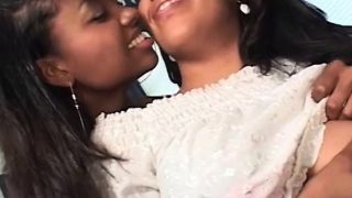 Sensual ebonies kissing and sucking big tits