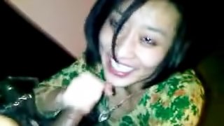 A horny asian slut gets filmed while giving her man a blowjob.