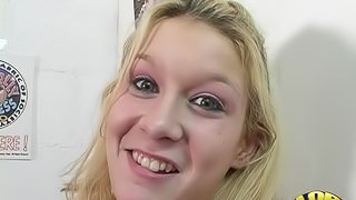 Naughty blonde wraps her mouth around a big black cock through the wall
