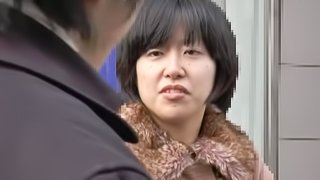 Nasty Japanese lady gives a blowjob in the car