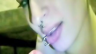 Pierced girl sucks dick like a pro