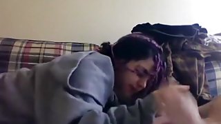 Petite emo girl gives her bf a blowjob on the sofa