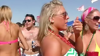 Pretty chicks wearing bikinis get caught on a voyeur's cam on a beach