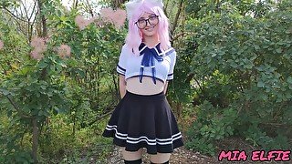 Sexy schoolgirl with ears in uniform walks down the abandoned road