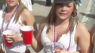 Rapturous babes elegantly dressed in red shorts getting drunk in a wild college party outdoor