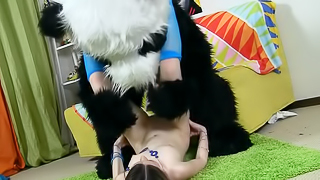 A teen brunette is getting fucked by a guy wearing a panda suit