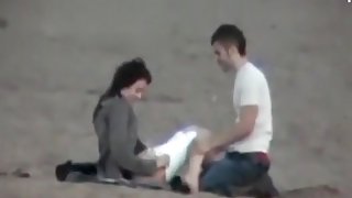 Couple on the beach gets spied on having sex during daytime