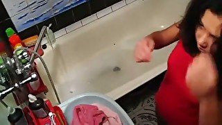 Tanned chick with small tits is masturbating in the bathtub