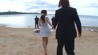 Asian hottie Mizuki Miri places her hairy twat on a cock at the beach