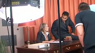 Blonde office chick has threesome sex in an office