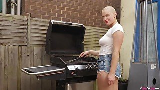 Busty bald girl with hairy pussy and armpits masturbates outdoors