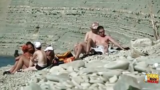 Missionary fuck outdoor on public rocky beach