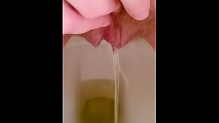 Close up hairy pussy piss and rub on toilet