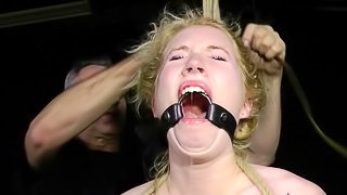 Tied bondage blonde screams when screwed with toy in BDSM