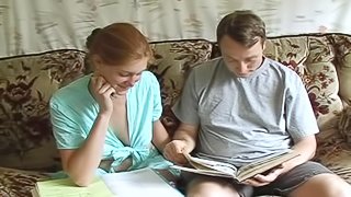 A redhead slut gets banged by her classmate in an apartment