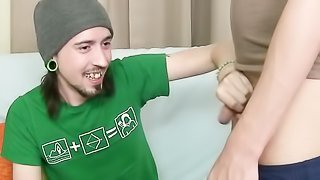 Skinny guy in green skirt is giving a blowjob to a naked horny fella