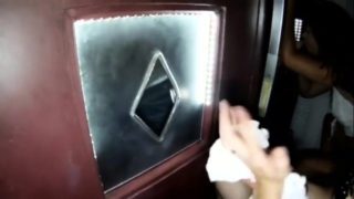 Hot wifes blows strangers in a glory hole booth