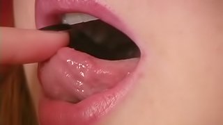 Kinky bitch named Halo shows her lips and tongue for the cam