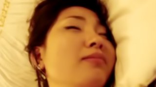Asian with hairy pussy is masturbating