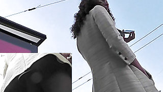 Elegant woman in sexy pantyhose on the upskirt camera