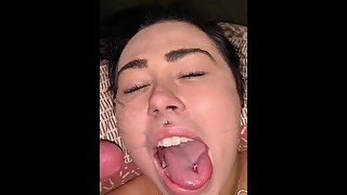 Gorgeous brunette strokes a big cock before getting huge load all over her face and lips pov