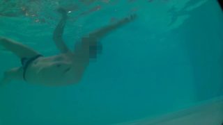 Underwater swimming with jockstrap in hotel pool