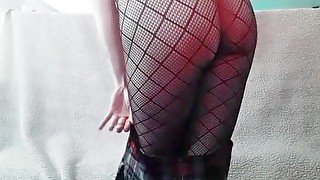 Hot  with fishnets and mini plaid skirt