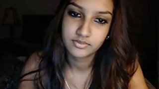 Sexy slender and long haired Desi webcam babe poses in the evening