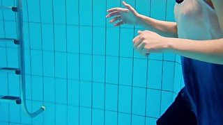 Teen Avenna swims naked wet in the pool