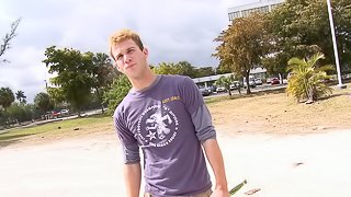 Affectionate gay in t-shirt moaning while being given blowjob