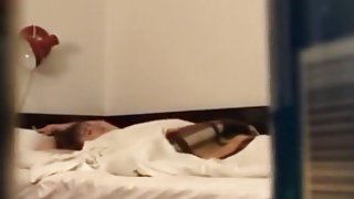 Voyeur tapes a skinny girl playing with herself and moaning on her bed