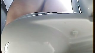Hidden public toilet cam shot of a womans pussy peeing