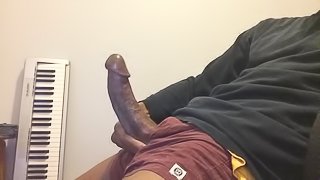 BIG LATINO COCK STROKES AND CUMS ALL OVER HIMSELF.