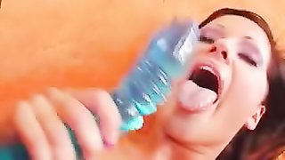 Dirty slut uses a plastic speculum to prepare for a bat.