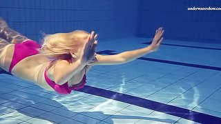 Hot ass blonde teen perfecting her seductive teases in pool