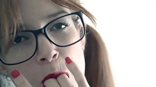 Cutie in nerd glasses plays with her gorgeous cunt
