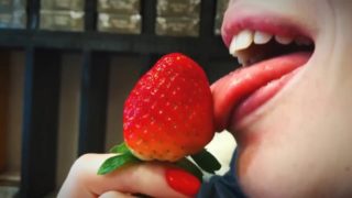Sexy lips blonde licking strawberry in 4K