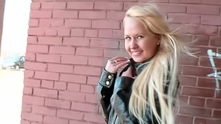 Flashing teen in skirt and leather jacket