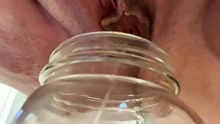 Horny BBW pisses in jar for fan