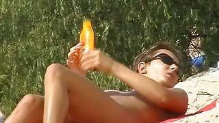 Beach video of perfect boobs being rubbed with tanning oil