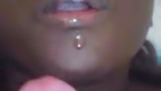 Ebony girl sucks a white dick and rubs it agaist her tits