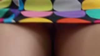 Amateur girl wearing a miniskirt gets caught on a voyeur's cam