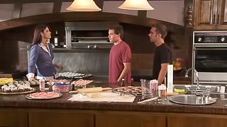 Brunette babe gets fucked and jizzed by two studs in the kitchen