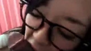 Japanese cutie with glasses sucks a cock