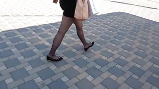 Flats miniskirt and sheer black pantyhose